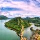Scenic view of Badi Lake in Udaipur surrounded by Aravalli hills during sunrise.
